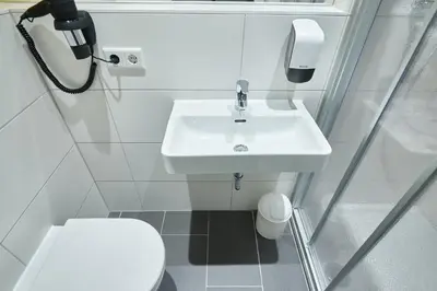 Ein Badezimmer in der Unterkunft McDreams Hotel Düsseldorf-City