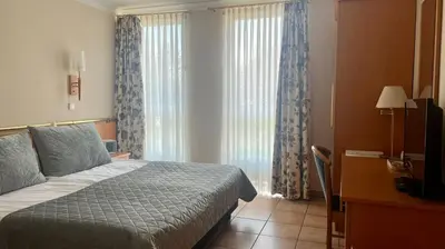Ein Bett oder Betten in einem Zimmer der Unterkunft Hotel Victoria