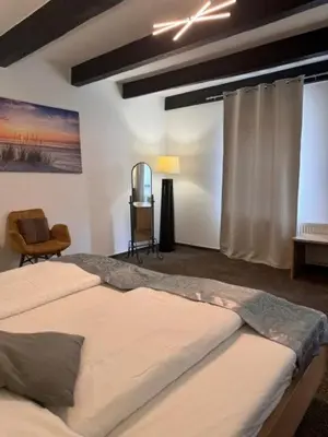 Ein Bett oder Betten in einem Zimmer der Unterkunft Hotel Biedermeier