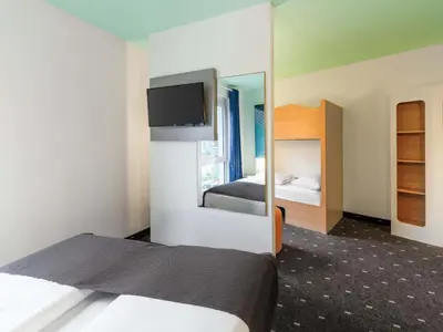 Ein Bett oder Betten in einem Zimmer der Unterkunft B&B HOTEL Wuppertal City-Süd