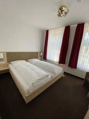 Ein Bett oder Betten in einem Zimmer der Unterkunft Hotel Alt Westerholt