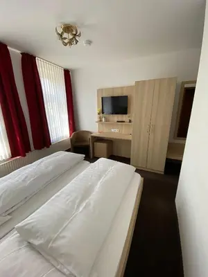 Ein Bett oder Betten in einem Zimmer der Unterkunft Hotel Alt Westerholt