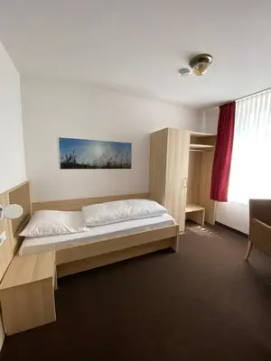 Ein Bett oder Betten in einem Zimmer der Unterkunft Hotel Alt Westerholt