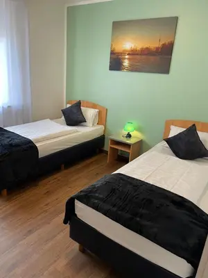 Ein Bett oder Betten in einem Zimmer der Unterkunft Residenz Hotel Wuppertal