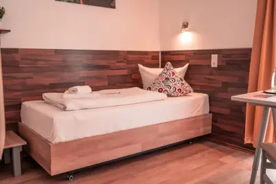 Ein Bett oder Betten in einem Zimmer der Unterkunft SSC Sport+Seminarcenter Radevormwald