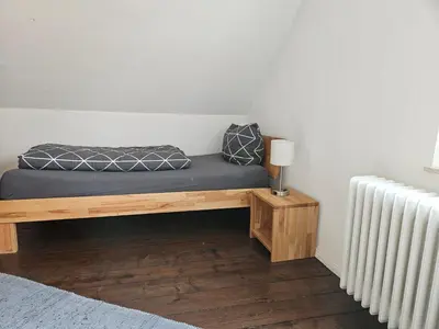 Ein Bett oder Betten in einem Zimmer der Unterkunft Ferienwohnung Oberhausen Alstaden