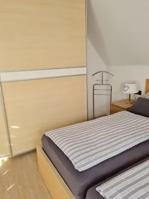 Ein Bett oder Betten in einem Zimmer der Unterkunft ElHa's FeWo