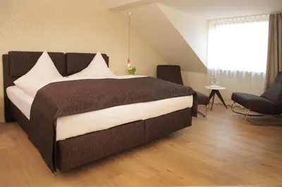 Ein Bett oder Betten in einem Zimmer der Unterkunft Haus Fliederbusch