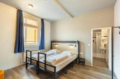 Ein Bett oder Betten in einem Zimmer der Unterkunft a&o Dortmund Hauptbahnhof