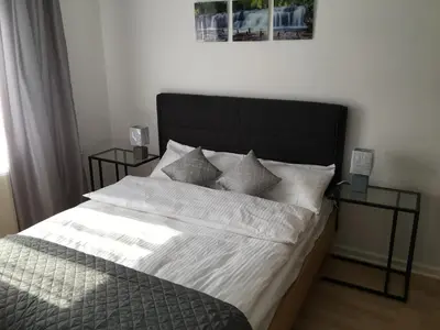 Ein Bett oder Betten in einem Zimmer der Unterkunft A&H Apartment