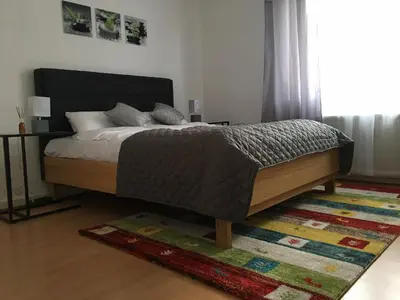 Ein Bett oder Betten in einem Zimmer der Unterkunft A&H Apartment