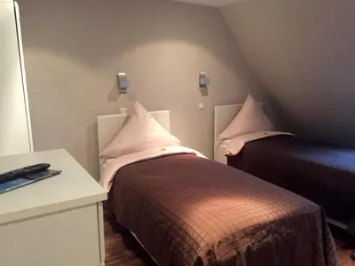 Ein Bett oder Betten in einem Zimmer der Unterkunft Pension am Zollverein