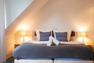 Ein Bett oder Betten in einem Zimmer der Unterkunft Helles Appartement mit eigenem Stellplatz