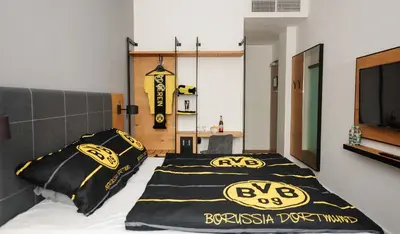 Ein Bett oder Betten in einem Zimmer der Unterkunft Coffee Fellows Hotel Dortmund