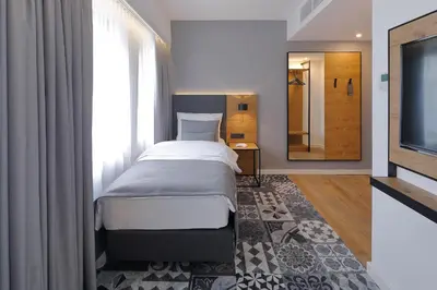 Ein Bett oder Betten in einem Zimmer der Unterkunft Coffee Fellows Hotel Dortmund