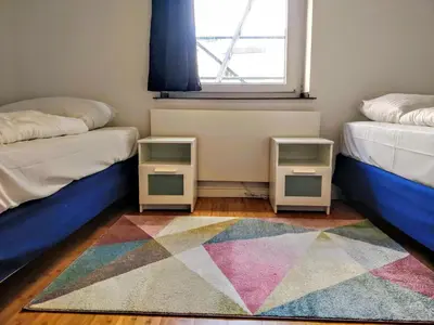 Ein Bett oder Betten in einem Zimmer der Unterkunft Bismarck MainHouse Apartments
