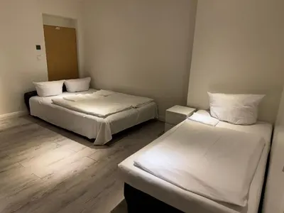 Ein Bett oder Betten in einem Zimmer der Unterkunft Bismarck MainHouse Apartments