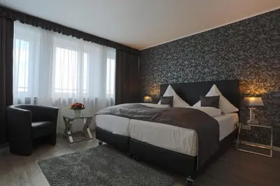 Ein Bett oder Betten in einem Zimmer der Unterkunft Boardinghouse Düsseldorf