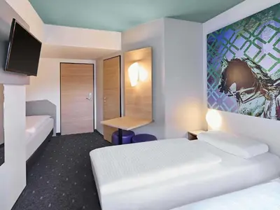 Ein Bett oder Betten in einem Zimmer der Unterkunft B&B Hotel Dortmund-City