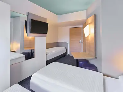 Ein Bett oder Betten in einem Zimmer der Unterkunft B&B Hotel Dortmund-City