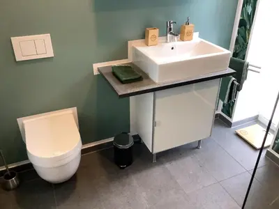 Ein Badezimmer in der Unterkunft Wohnungen mit Balkon, 2 Schlafzimmer, nahe Centro & Arena