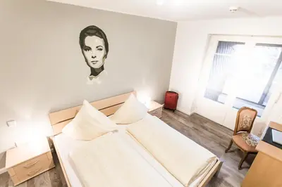Ein Bett oder Betten in einem Zimmer der Unterkunft Hotel Rave