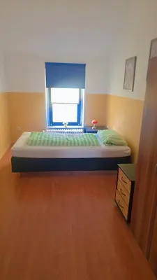 Ein Bett oder Betten in einem Zimmer der Unterkunft Johnny's wohnen auf Zeit