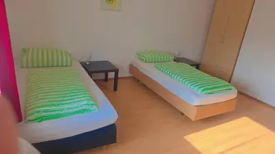 Ein Bett oder Betten in einem Zimmer der Unterkunft Johnny's wohnen auf Zeit