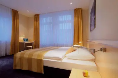Ein Bett oder Betten in einem Zimmer der Unterkunft Gästehaus Rohleder