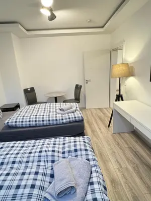 Ein Bett oder Betten in einem Zimmer der Unterkunft House-In Apartments Essen - Free Parking - WiFi - Kitchen