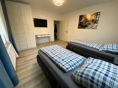 Ein Bett oder Betten in einem Zimmer der Unterkunft House-In Apartments Essen - Free Parking - WiFi - Kitchen