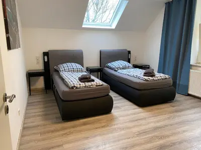 Ein Bett oder Betten in einem Zimmer der Unterkunft House-In Apartments Essen - Free Parking - WiFi - Kitchen
