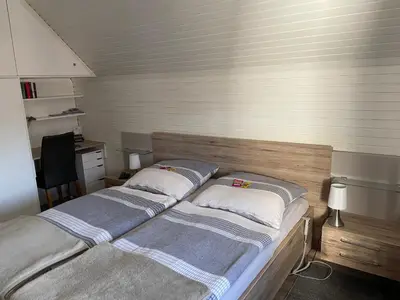 Ein Bett oder Betten in einem Zimmer der Unterkunft Ferienwohnungen Saarn