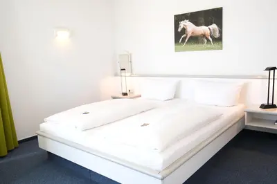Ein Bett oder Betten in einem Zimmer der Unterkunft Vivotel Niederrhein