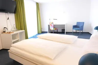 Ein Bett oder Betten in einem Zimmer der Unterkunft Vivotel Niederrhein