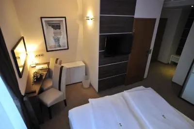 Ein Bett oder Betten in einem Zimmer der Unterkunft Hotel Bergischer Hof