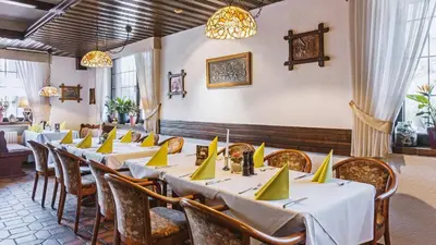Ein Sitzbereich in der Unterkunft Hotel Restaurant Menden