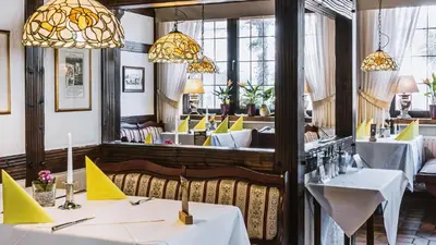 Ein Sitzbereich in der Unterkunft Hotel Restaurant Menden