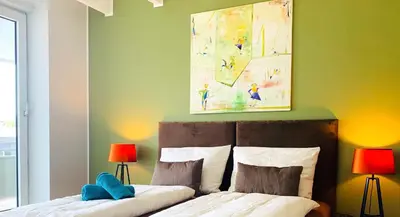 Ein Bett oder Betten in einem Zimmer der Unterkunft BESOTEL Mettmann- 20 Wohnungen 2 Standorte 35 Schlafzimmer 29 Badezimmer 52 Betten für 73 Gäste