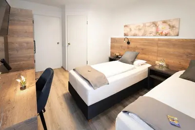 Ein Bett oder Betten in einem Zimmer der Unterkunft Zur Alten Post