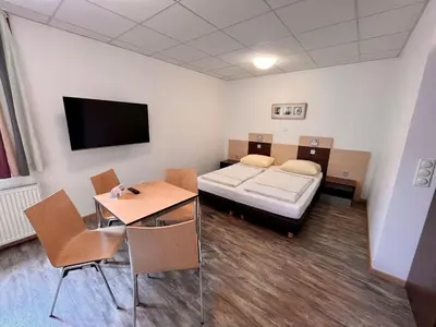 Ein Bett oder Betten in einem Zimmer der Unterkunft DJH-Gästehaus Bermuda3Eck
