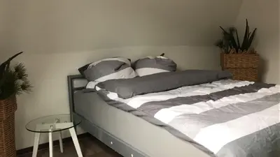 Ein Bett oder Betten in einem Zimmer der Unterkunft Stadtvilla Kö97 - Apartment Relax
