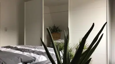 Ein Bett oder Betten in einem Zimmer der Unterkunft Stadtvilla Kö97 - Apartment Relax
