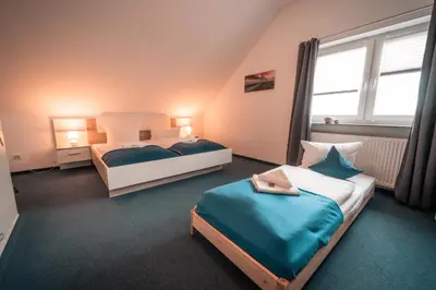 Ein Bett oder Betten in einem Zimmer der Unterkunft Airport Lounge Hotel Düsseldorf