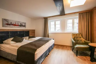 Ein Bett oder Betten in einem Zimmer der Unterkunft Zur alten Krone