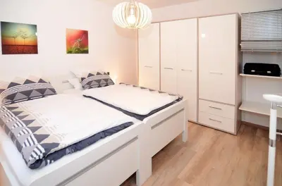 Ein Bett oder Betten in einem Zimmer der Unterkunft Ferienwohnung Marion