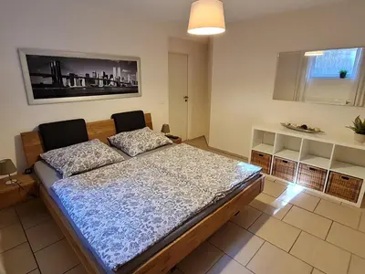 Ein Bett oder Betten in einem Zimmer der Unterkunft Ferienwohnung auf dem Land Schermbeck Moviepark
