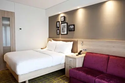 Ein Bett oder Betten in einem Zimmer der Unterkunft Hampton By Hilton Dortmund Phoenix See