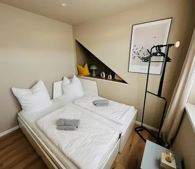 Ein Bett oder Betten in einem Zimmer der Unterkunft Blankensteiner Seeblick