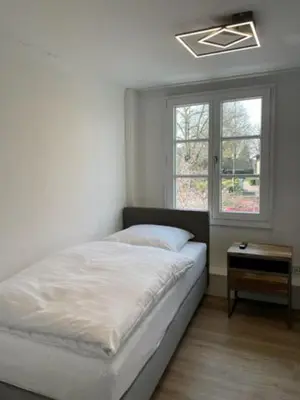 Ein Bett oder Betten in einem Zimmer der Unterkunft Hotel Jägerhof